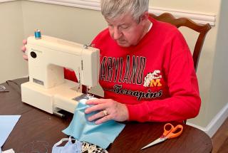 Randy Lord sews masks